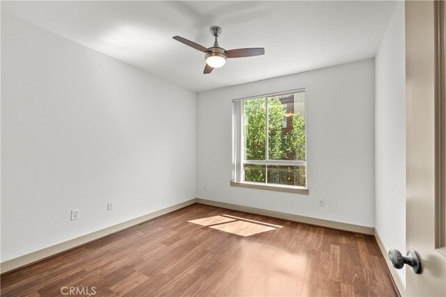 24535 Town Center Dr Unit 6309, Valencia, CA 91355 - unfurnished room featuring wood finished floors, a ceiling fan, and baseboards