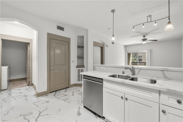 24535 Town Center Dr Unit 6309, Valencia, CA 91355 - kitchen featuring dishwasher, a sink, white cabinets, and arched walkways