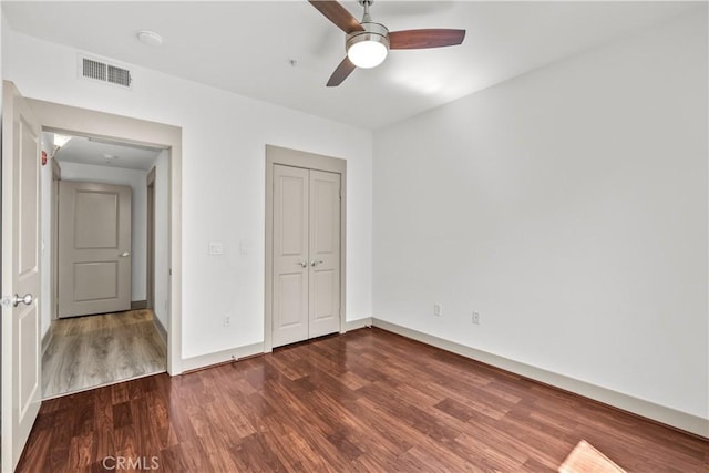 24535 Town Center Dr Unit 6309, Valencia, CA 91355 - unfurnished bedroom with wood finished floors, a closet, baseboards, and a ceiling fan