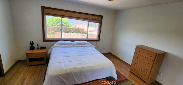 bedroom featuring light wood-style flooring