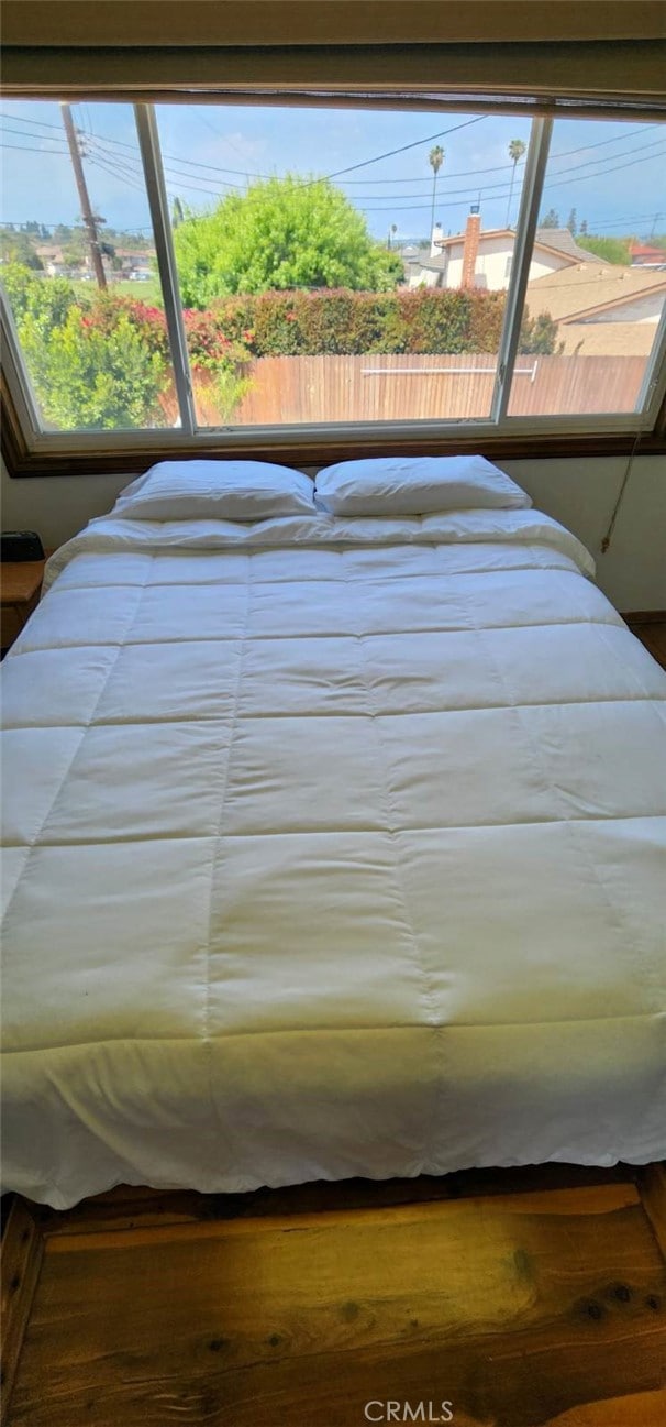 bedroom with multiple windows