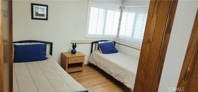 bedroom featuring wood finished floors