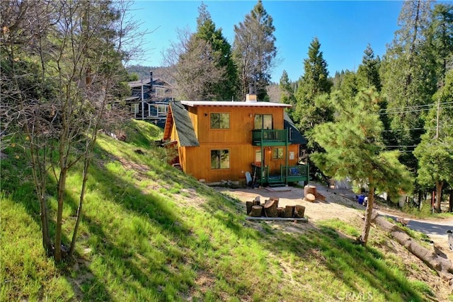 29278 Pine Dr, Cedar Glen, CA 92321 - rear view of property with a chimney and a balcony