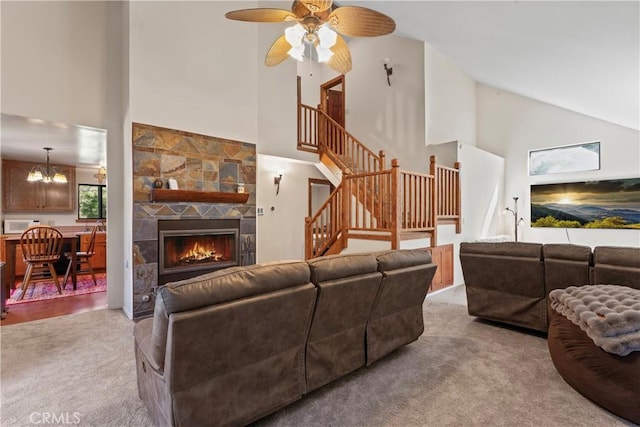 29278 Pine Dr, Cedar Glen, CA 92321 - living room featuring high vaulted ceiling, carpet, stairway, ceiling fan, and a fireplace