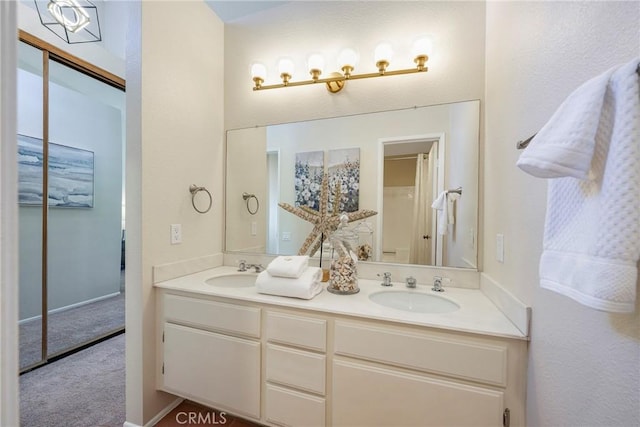 bathroom with double vanity and a sink