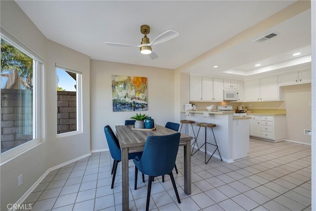 dining space with a ceiling fan, baseboards, recessed lighting, light tile patterned floors, and visible vents