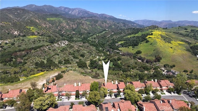birds eye view of property with a mountain view