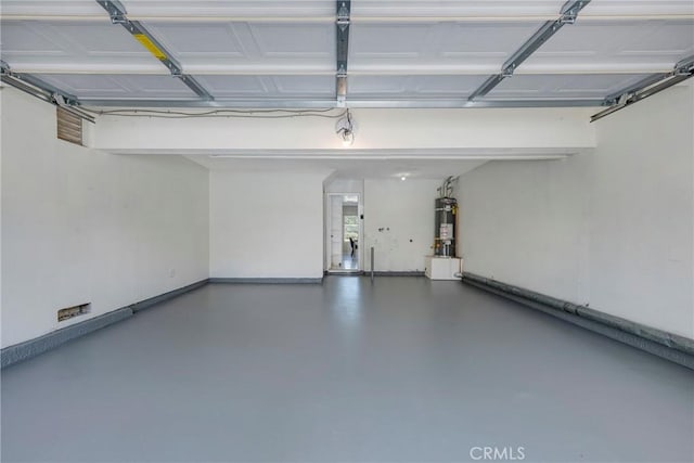 garage featuring secured water heater