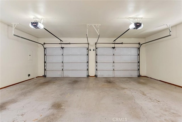 22975 Flournoy Ave, Corning, CA 96021 - garage featuring a garage door opener and baseboards