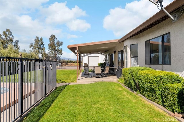 22975 Flournoy Ave, Corning, CA 96021 - view of yard with fence, an outbuilding, and a patio