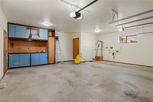 22975 Flournoy Ave, Corning, CA 96021 - garage featuring baseboards and a garage door opener