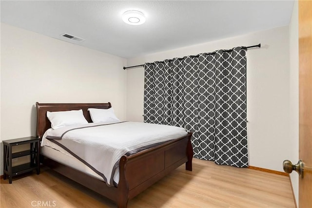 22975 Flournoy Ave, Corning, CA 96021 - bedroom with light wood-type flooring, visible vents, and baseboards