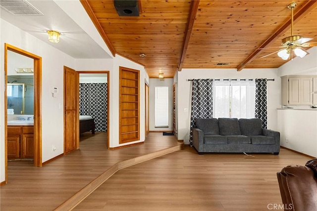 22975 Flournoy Ave, Corning, CA 96021 - living room with light wood finished floors, baseboards, visible vents, and ceiling fan