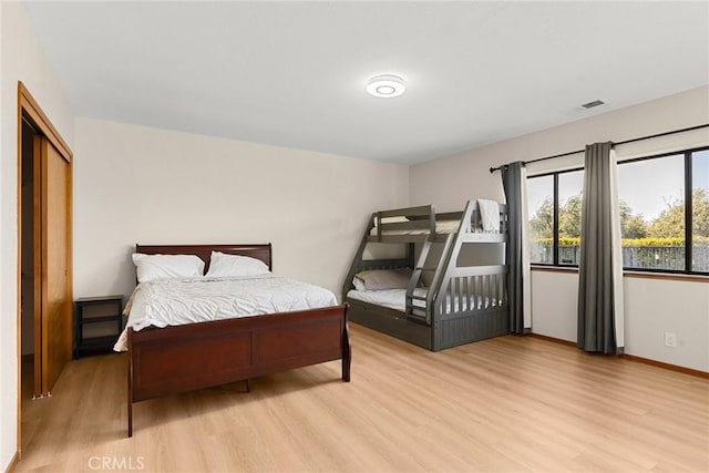 22975 Flournoy Ave, Corning, CA 96021 - bedroom featuring baseboards, light wood finished floors, and visible vents