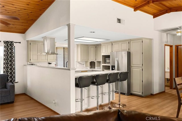 22975 Flournoy Ave, Corning, CA 96021 - kitchen featuring a ceiling fan, island range hood, light wood-type flooring, wooden ceiling, and stainless steel refrigerator with ice dispenser