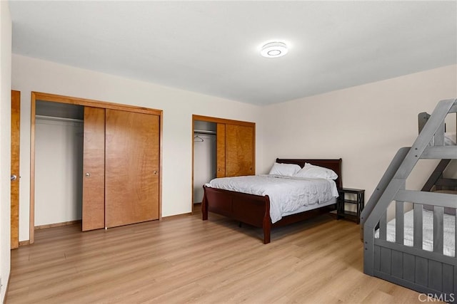 22975 Flournoy Ave, Corning, CA 96021 - bedroom featuring light wood-type flooring and two closets