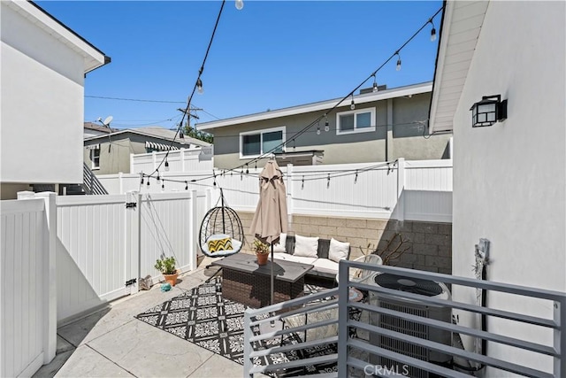 view of patio with outdoor lounge area and a fenced backyard