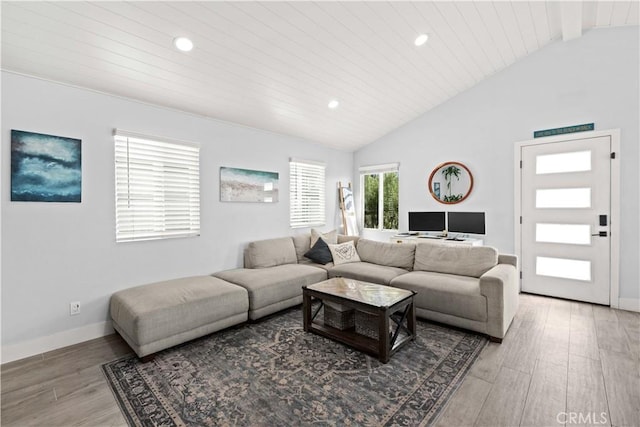 living area featuring vaulted ceiling, wood finished floors, recessed lighting, and wooden ceiling