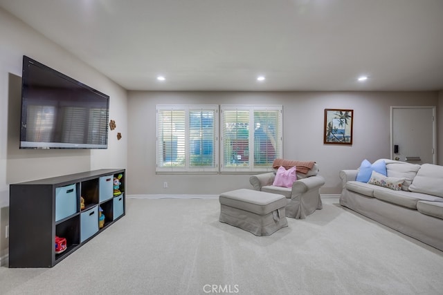 living area with baseboards, recessed lighting, and carpet floors