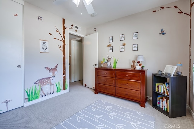 bedroom featuring visible vents, a ceiling fan, and carpet floors