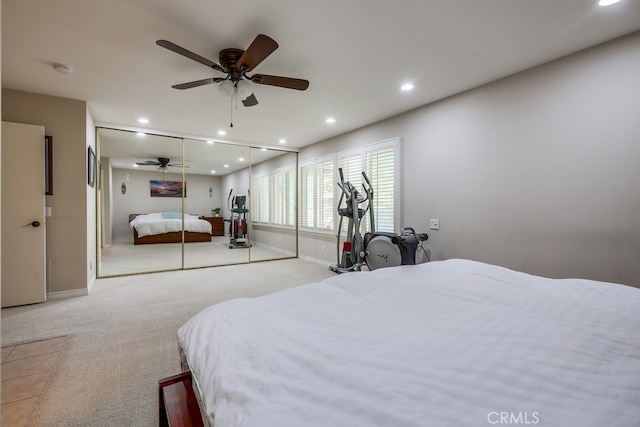 carpeted bedroom with baseboards, recessed lighting, and a ceiling fan