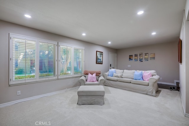 living room with baseboards, recessed lighting, and carpet floors