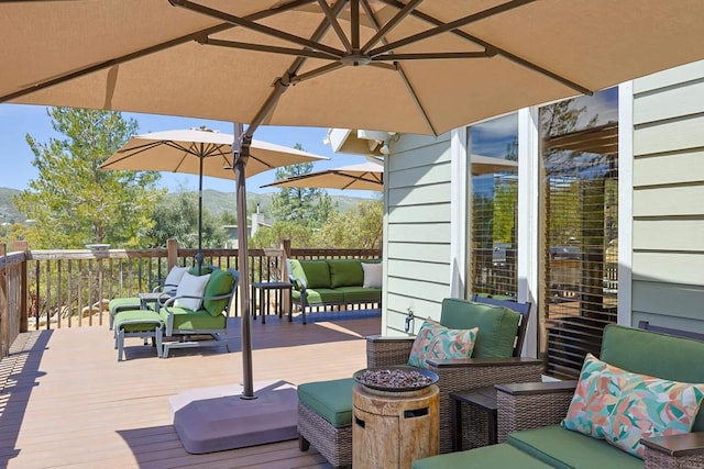 wooden terrace featuring an outdoor living space