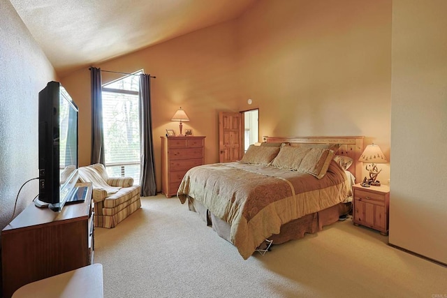 bedroom with light carpet and vaulted ceiling