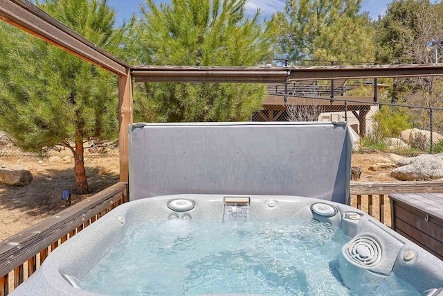 exterior space with a covered hot tub