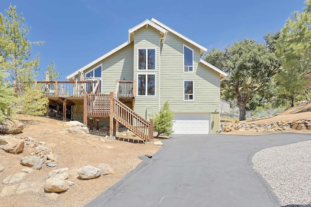 8551 Foothill Blvd, Pine Valley, CA 91962 - view of home's exterior with stairs, a wooden deck, a garage, and asphalt driveway