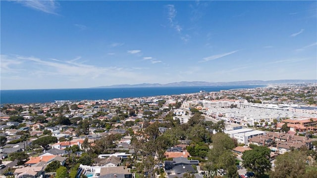 birds eye view of property featuring a water and mountain view