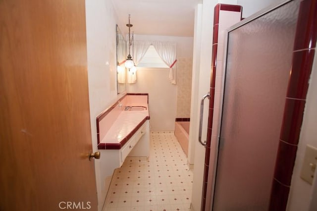 full bathroom featuring tile patterned floors, a garden tub, vanity, and a shower stall