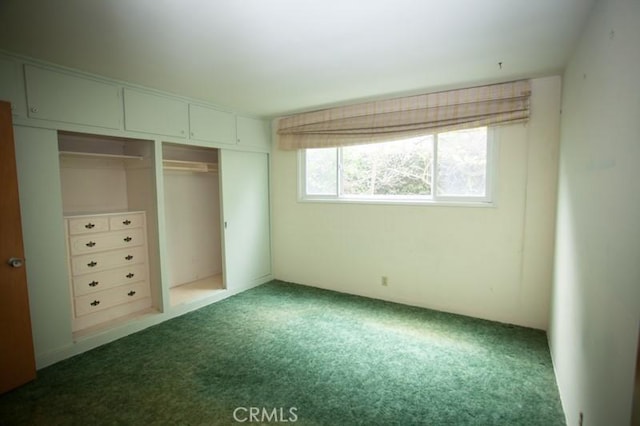 unfurnished bedroom featuring a closet and carpet