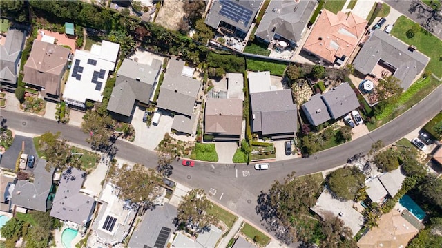 birds eye view of property with a residential view