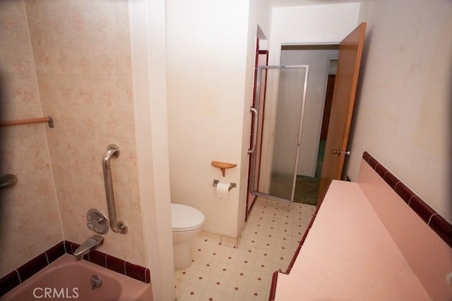 full bathroom featuring shower / bath combination, tile patterned floors, and toilet