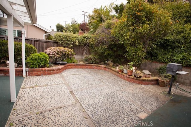 view of patio / terrace featuring fence