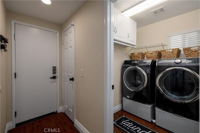 33077 Monte Dr, Temecula, CA 92592 - laundry room with cabinet space, washing machine and dryer, and dark wood-style floors