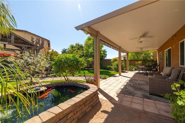 33077 Monte Dr, Temecula, CA 92592 - view of patio / terrace with a small pond, ceiling fan, outdoor dining area, and a fenced backyard
