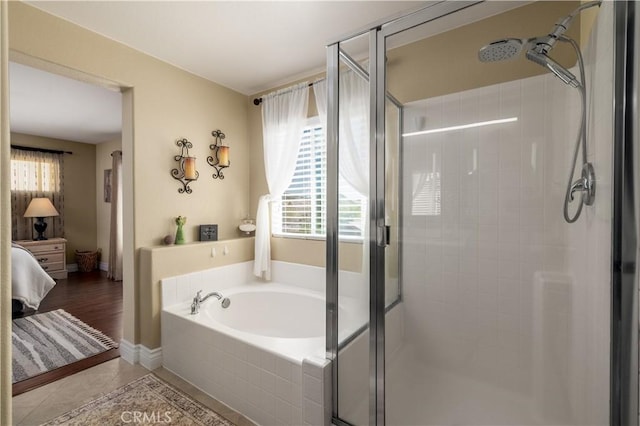 33077 Monte Dr, Temecula, CA 92592 - bathroom featuring connected bathroom, a healthy amount of sunlight, a garden tub, and a stall shower