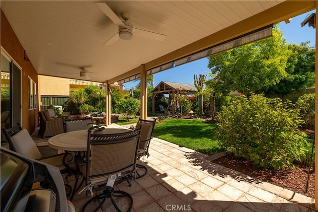 33077 Monte Dr, Temecula, CA 92592 - view of patio featuring a gazebo, a ceiling fan, fence, and outdoor dining space