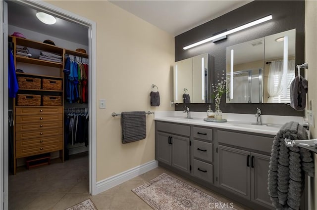 33077 Monte Dr, Temecula, CA 92592 - bathroom featuring double vanity, tile patterned floors, a sink, and a stall shower