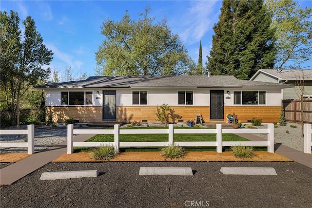 single story home featuring a front yard and a fenced front yard