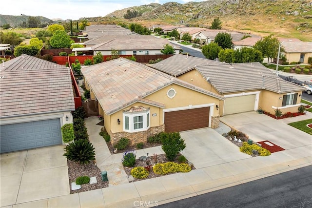 bird's eye view featuring a residential view and a mountain view