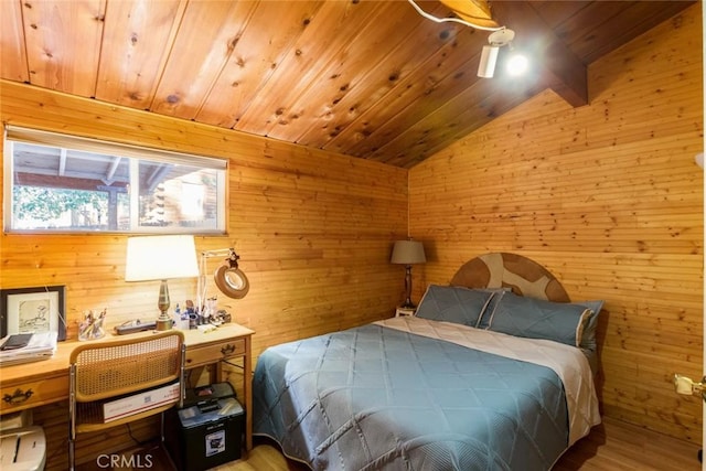 bedroom with wooden ceiling, wood walls, lofted ceiling, and wood finished floors