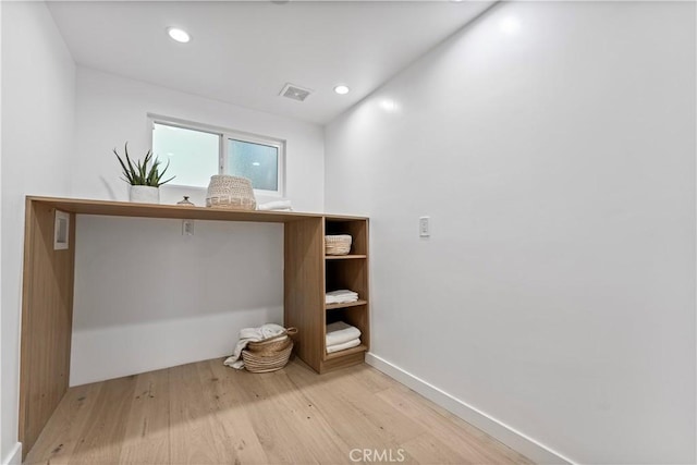 interior space with recessed lighting, visible vents, wood finished floors, and baseboards