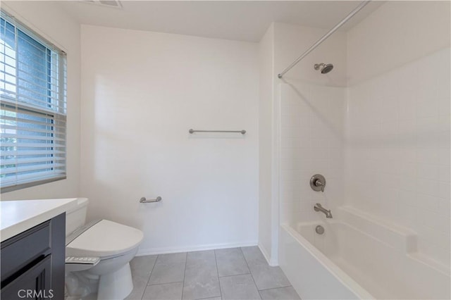 bathroom with bathtub / shower combination, vanity, toilet, tile patterned floors, and baseboards