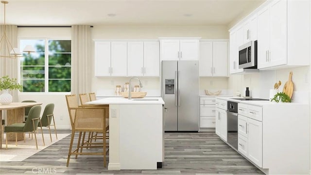 kitchen featuring a sink, oven, stainless steel fridge with ice dispenser, light wood finished floors, and light countertops