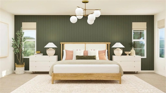 bedroom with baseboards, carpet flooring, and a notable chandelier