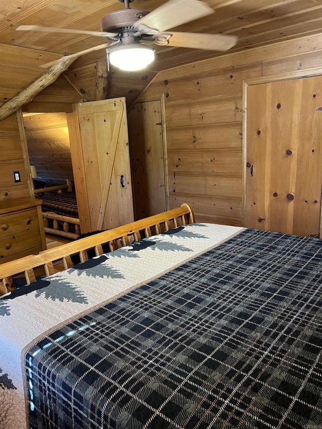 bedroom featuring wood ceiling, wood walls, and vaulted ceiling
