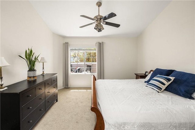 bedroom with ceiling fan and light carpet